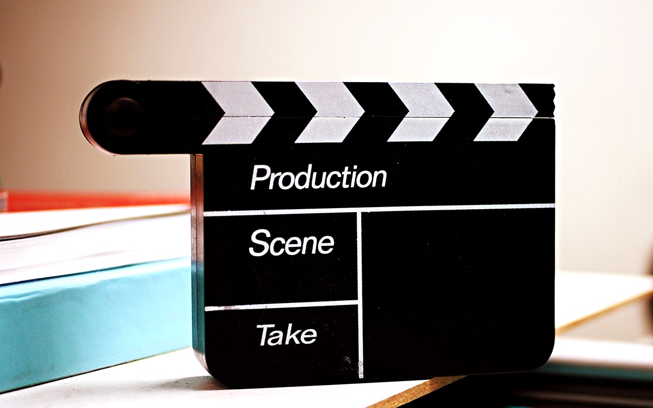 Film clapboard representing security for costs in civil litigation over film documentary