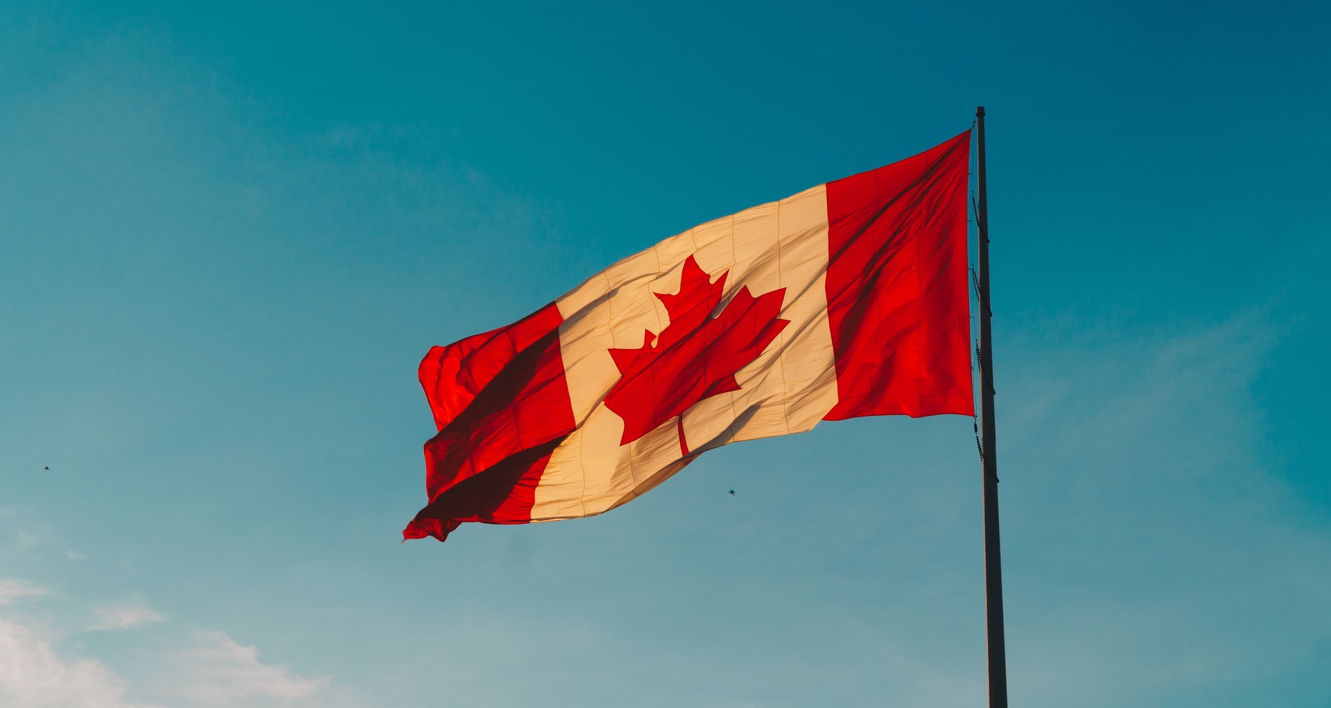 Canadian flag representing a person being denied entry to Canada for misrepresenting material facts in their application